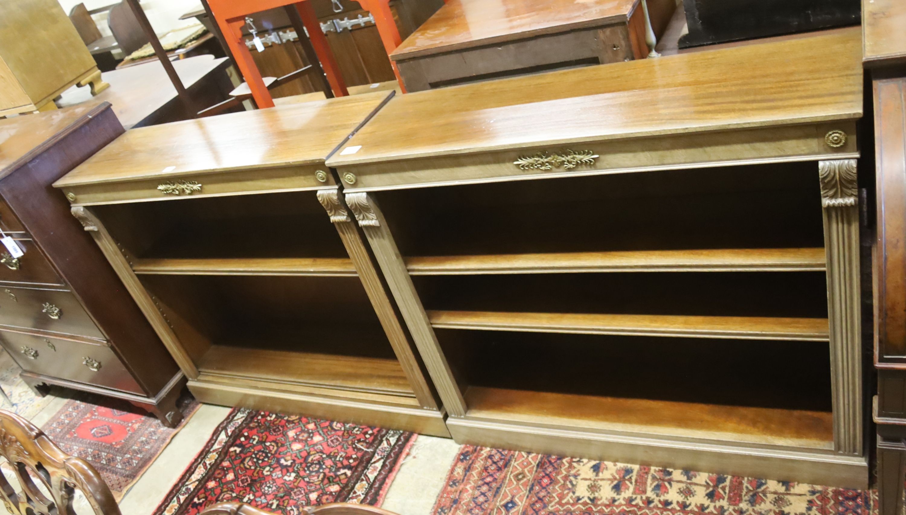 A pair of Regency style faded mahogany gilt metal mounted dwarf open bookcases, width 107cm, depth 34cm, height 93cm